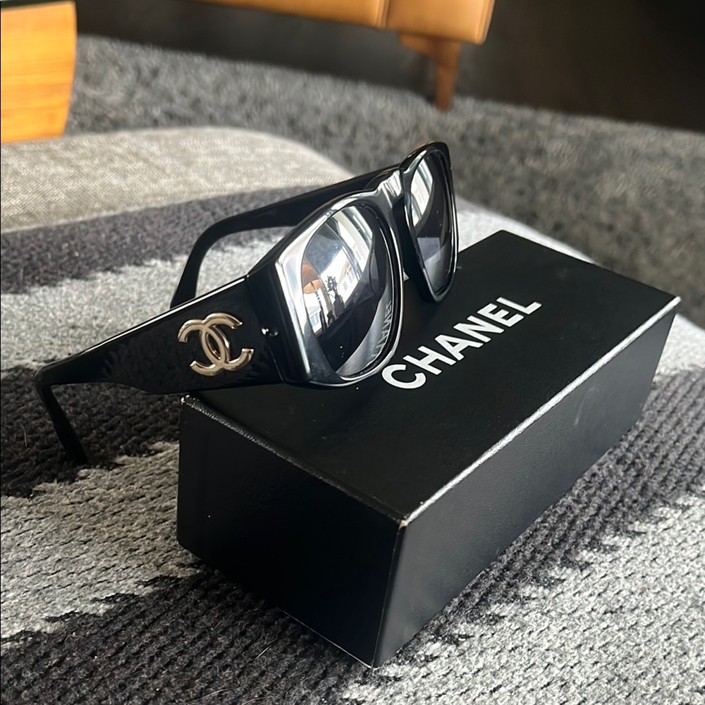 CHANEL Glossy Black Sunglasses with Silver Logo